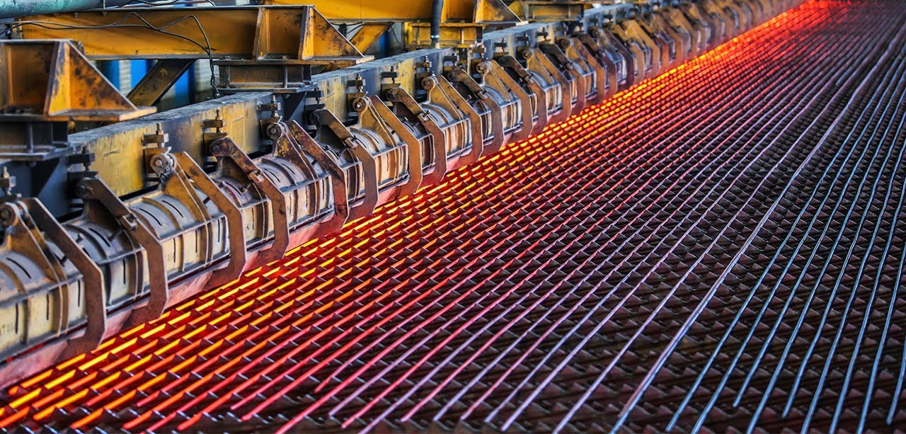 Rebar processing at TREMO's facility, showcasing reinforced and aligned bars ready for cutting and bending